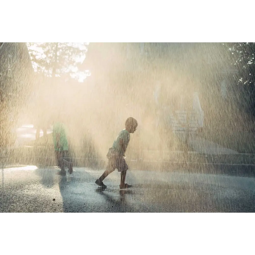 children playing in rain during summer
